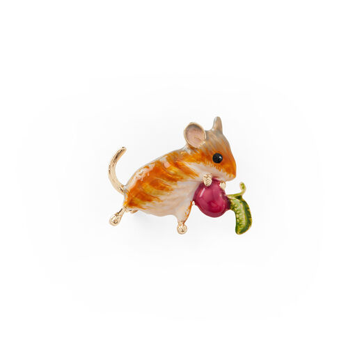 A brooch in the shape of a vole holding a radish.